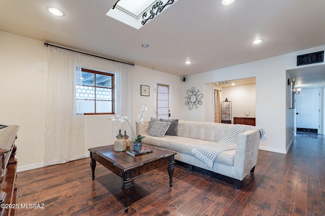 living room with baseboards, dark wood finished floors, and recessed lighting