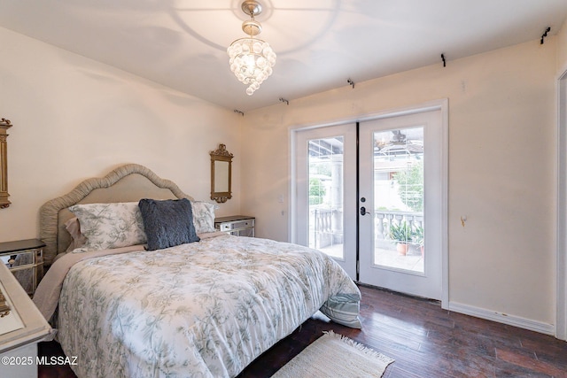 bedroom featuring dark wood-style floors, access to outside, french doors, and baseboards