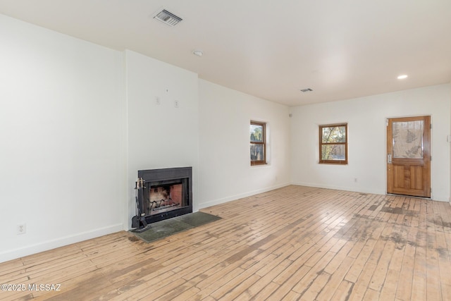 unfurnished living room featuring light wood-type flooring