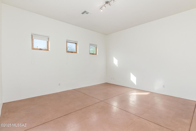 spare room with concrete flooring