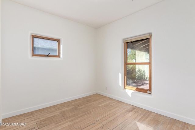 spare room with light hardwood / wood-style flooring