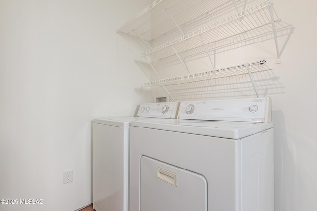 laundry room featuring washing machine and clothes dryer