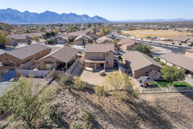 aerial view featuring a mountain view and a residential view