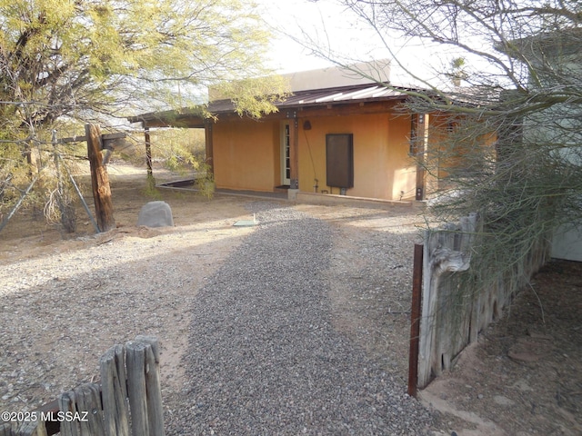 exterior space featuring a standing seam roof and metal roof