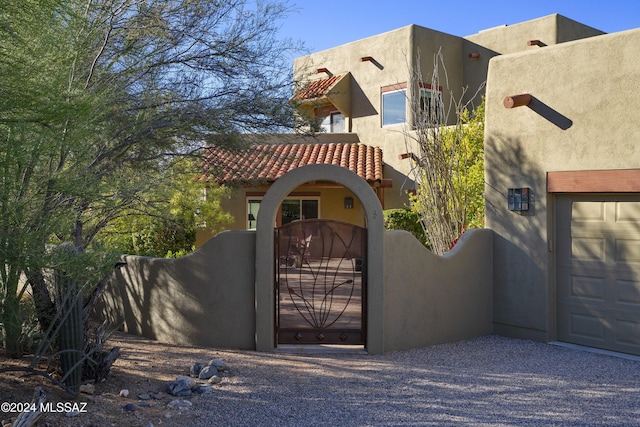 view of gate featuring a garage