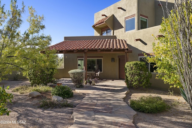 rear view of property with a patio