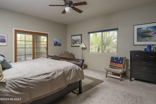 bedroom featuring light carpet and ceiling fan