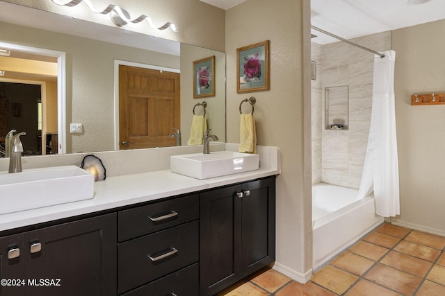 bathroom with tile patterned floors, vanity, and shower / tub combo