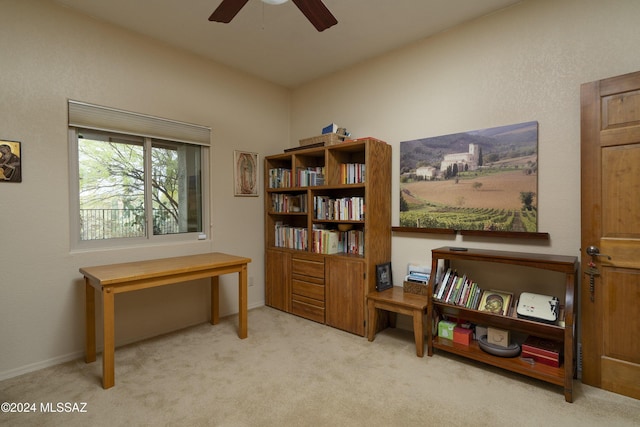 interior space with light carpet and ceiling fan