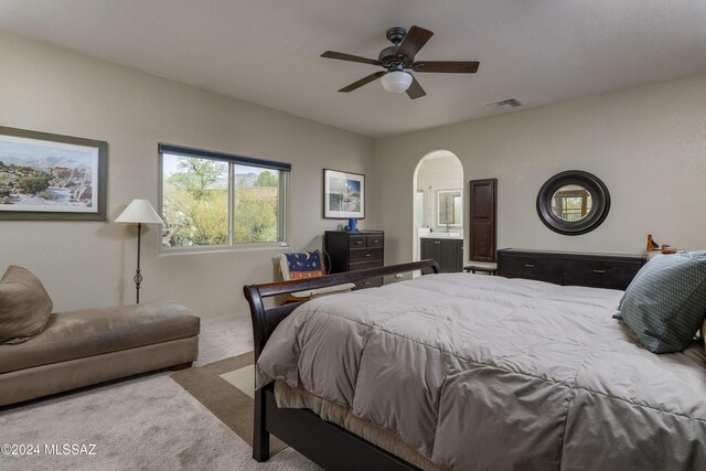 living room featuring light carpet and ceiling fan