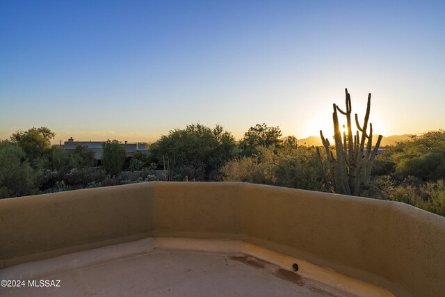 back of house with a pool with hot tub, a mountain view, and a patio area