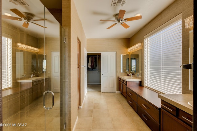 bathroom with vanity, tile patterned floors, an enclosed shower, and ceiling fan