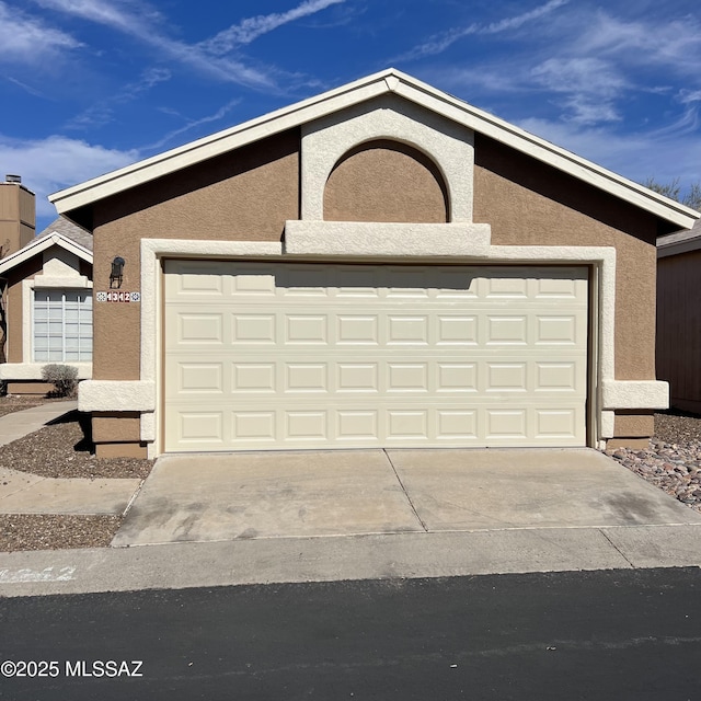 exterior space with concrete driveway