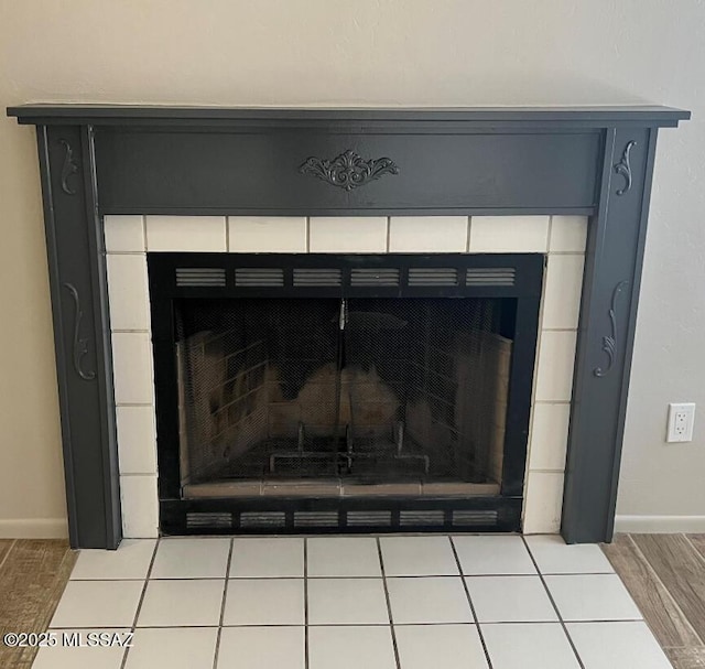 details with a fireplace and baseboards