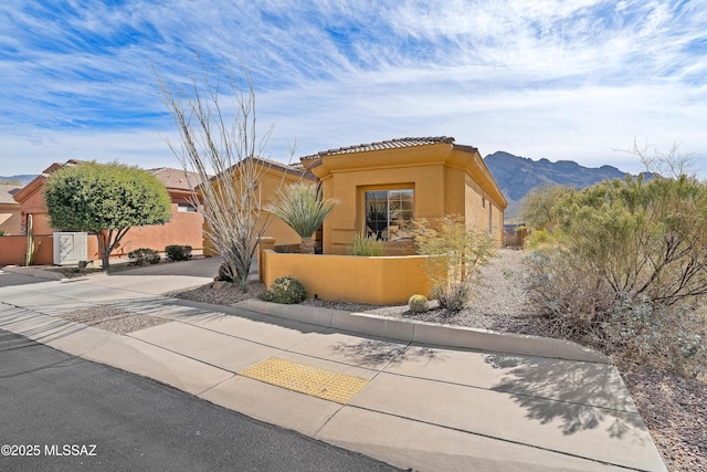 view of front of house with a mountain view