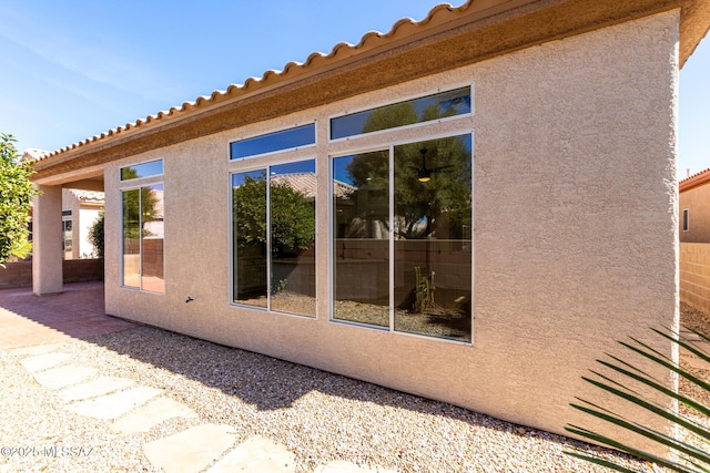 view of property exterior featuring a patio