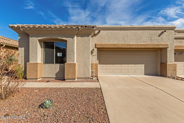 view of front of home with a garage