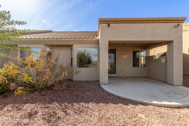 rear view of property with a patio area