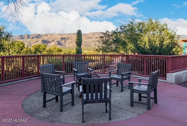 view of patio / terrace featuring a mountain view