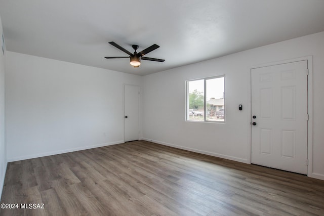 spare room with ceiling fan and light hardwood / wood-style floors