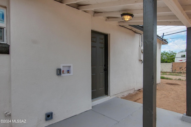 doorway to property with a patio area