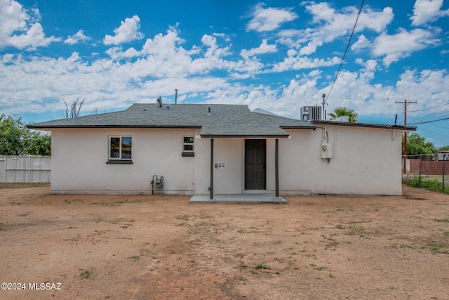 rear view of property with a patio and central air condition unit