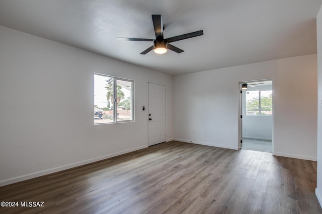 spare room with light hardwood / wood-style flooring and ceiling fan