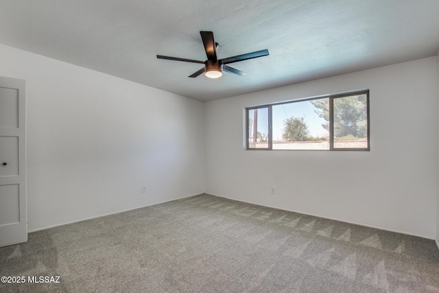 unfurnished room featuring carpet floors and ceiling fan