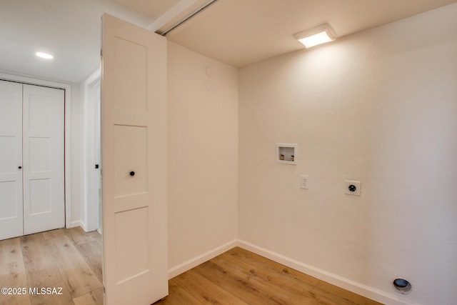 laundry room with light wood-type flooring, laundry area, hookup for a washing machine, and electric dryer hookup