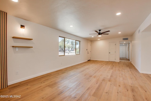 spare room with recessed lighting, visible vents, light wood-style floors, ceiling fan, and baseboards