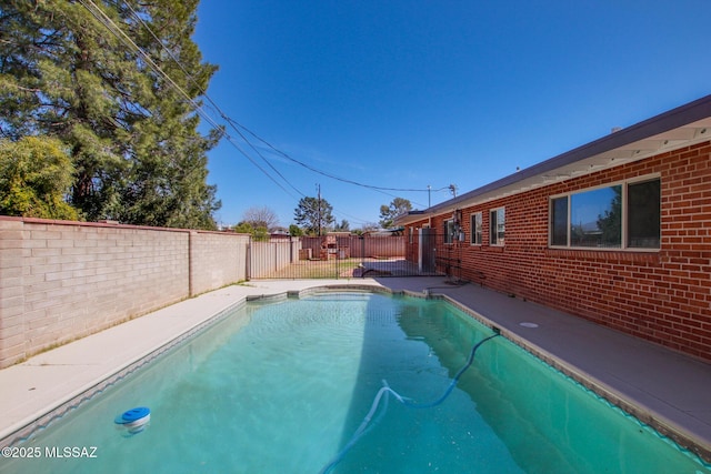 view of swimming pool featuring a fenced in pool and a fenced backyard