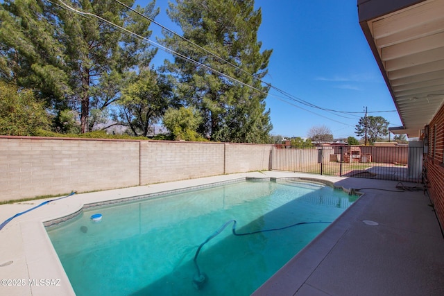 view of swimming pool with a fenced in pool and a fenced backyard