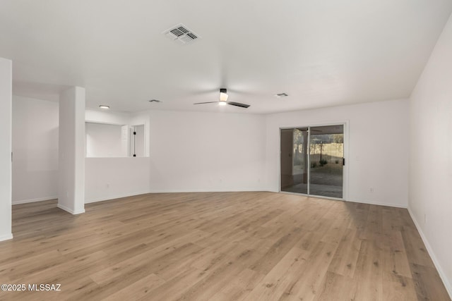 spare room featuring ceiling fan and light hardwood / wood-style flooring