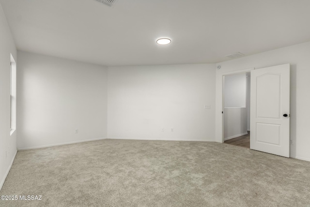 empty room featuring carpet flooring