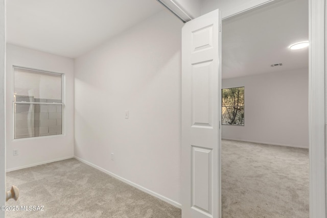 empty room with light colored carpet