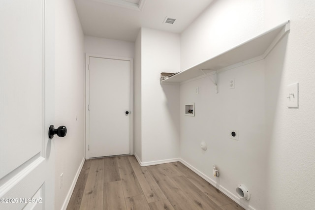 clothes washing area with gas dryer hookup, washer hookup, hookup for an electric dryer, and light wood-type flooring