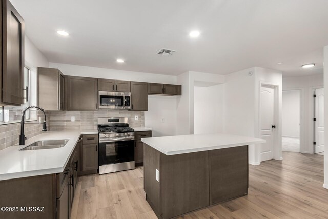 spare room with ceiling fan and light hardwood / wood-style flooring