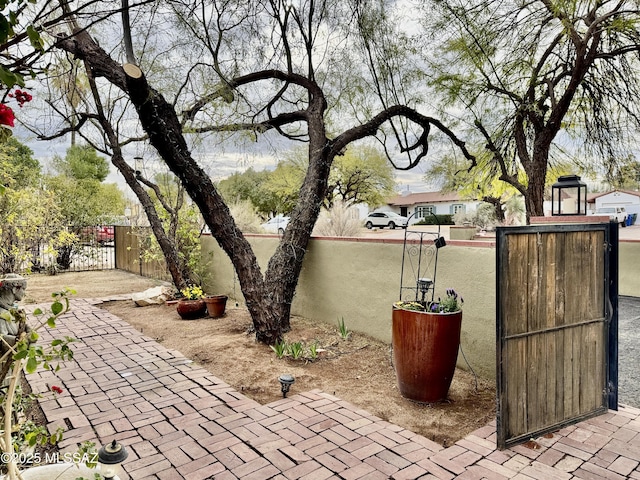 view of patio / terrace with a gate and fence