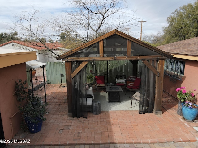 view of patio / terrace with outdoor lounge area and fence