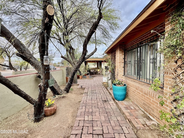 view of patio featuring fence