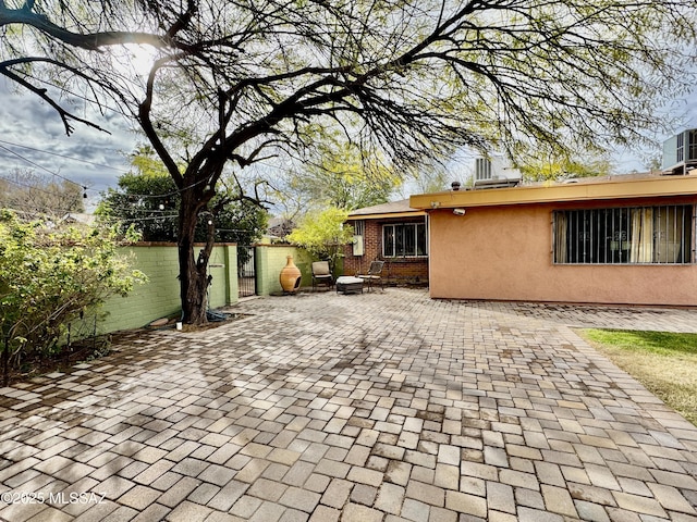 view of patio featuring fence