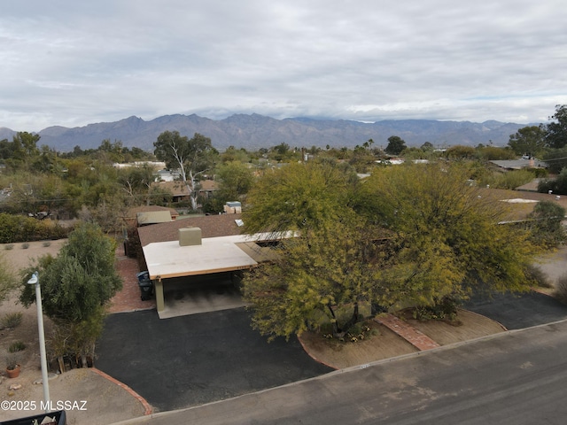 birds eye view of property with a mountain view