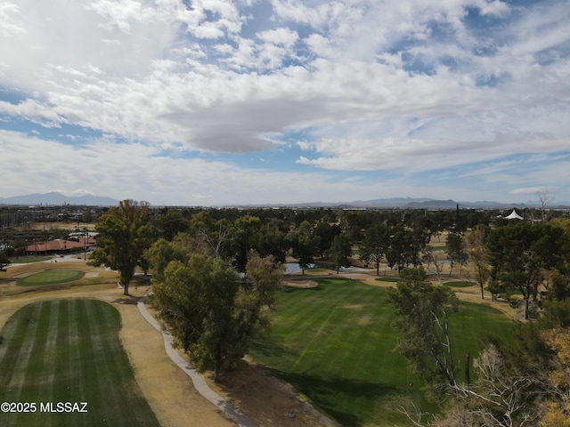 drone / aerial view with a mountain view and golf course view