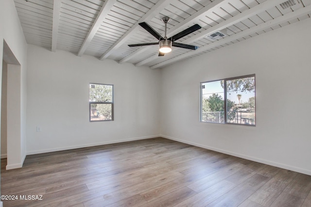 spare room with wood ceiling, ceiling fan, hardwood / wood-style flooring, and beamed ceiling