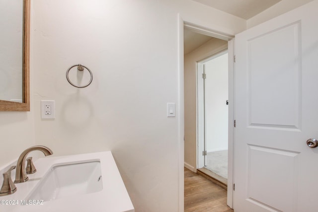 bathroom with vanity and hardwood / wood-style floors