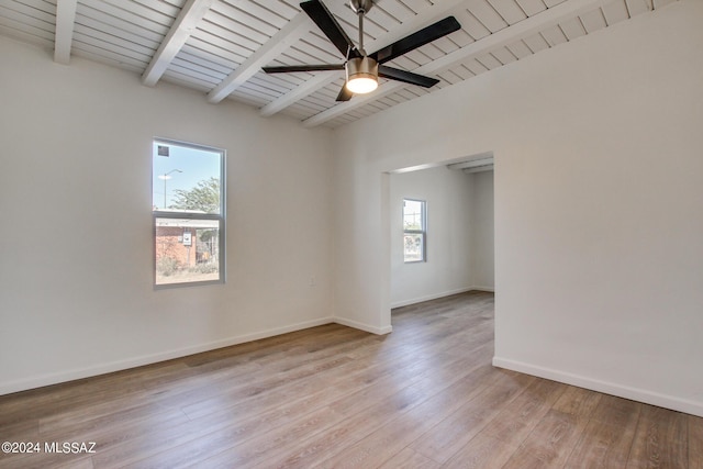 empty room with beamed ceiling, ceiling fan, wood ceiling, and light wood-type flooring