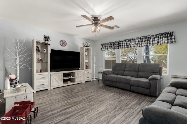 living room with ceiling fan and hardwood / wood-style floors