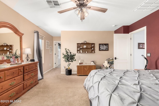 bedroom with ceiling fan and light carpet
