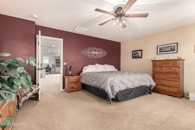 bedroom with light colored carpet and ceiling fan