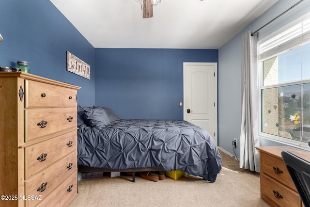 carpeted bedroom with ceiling fan